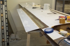 Bonded the top support laminate for the wing upper trailing edge extension.