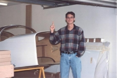 this is my brother. He was going to help me unload the kit, but showed up after I was finished. UmmmmUmmmUmm! He did help me tape the fuselage halves together so they would hold there shape until I started working on them.