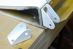 Fabricated aileron actuator fittings and laminated all the flap ribs. These are the fittings after powder-coating.