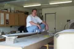 Routed out the foam around the hole for the horizontal stabilizer. Inserted the horizontal stabilizer in the fuselage started the jigging process. This photo shows me stress testing the horizontal stabilizer before installation.