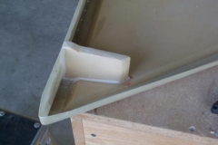 Cut and fit the foam for the rudder actuator rib. Sealed the rib and bonded it in place. Cut the cloth and laminated 4 layers on each side. This photo was taken after I had bonded the rib in place.