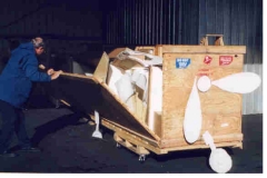 Kit arrives at Nut Tree Airport in Vacaville, CA. Dad commadeers fork lift and driver from Col. Duncan to help unload the 4'X 5' X 24' crate.