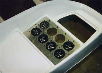 Trimmed engine instrument alum panel to size, drilled mounting holes and installed nutplates in intrument panel.