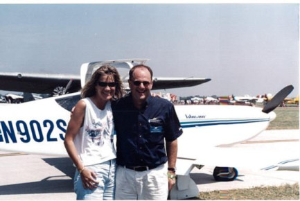 Another Oshkosh 1999 photo, this is my girl friend and Bob Gavinsky, president of Stoddard Haminton. They just got back from the demo flight. She said she showed Bob how to do loops, rolls etc.....