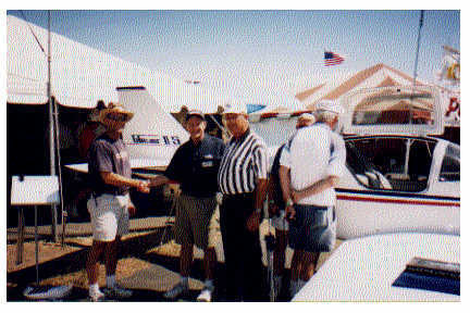 After demo flights in the RV-6, Lancair 360, and Glasair Super II at Oshkosh (Air Venture), Kurt and John seal the deal for a Super II by shaking hands with Bob Gavinsky. The demo flight was awesome with Jeff Wernli! Delivery should be in a few months...(Oct 98?).