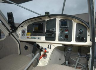 Low corners on the sides of the instrument panel enhance visibility, but the center column could impede access and reduce leg comfort. Photo: Peter Braswell.