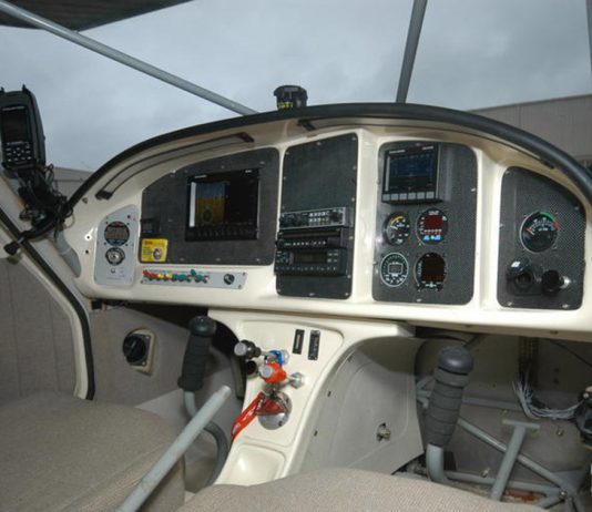 Low corners on the sides of the instrument panel enhance visibility, but the center column could impede access and reduce leg comfort. Photo: Peter Braswell.
