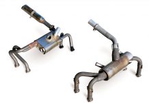 The Power Flow system (left) has a much larger final exhaust pipe and a smaller heater muff compared to the standard system (right).
