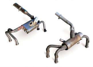 The Power Flow system (left) has a much larger final exhaust pipe and a smaller heater muff compared to the standard system (right).