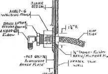 Flop tube through header tank wall